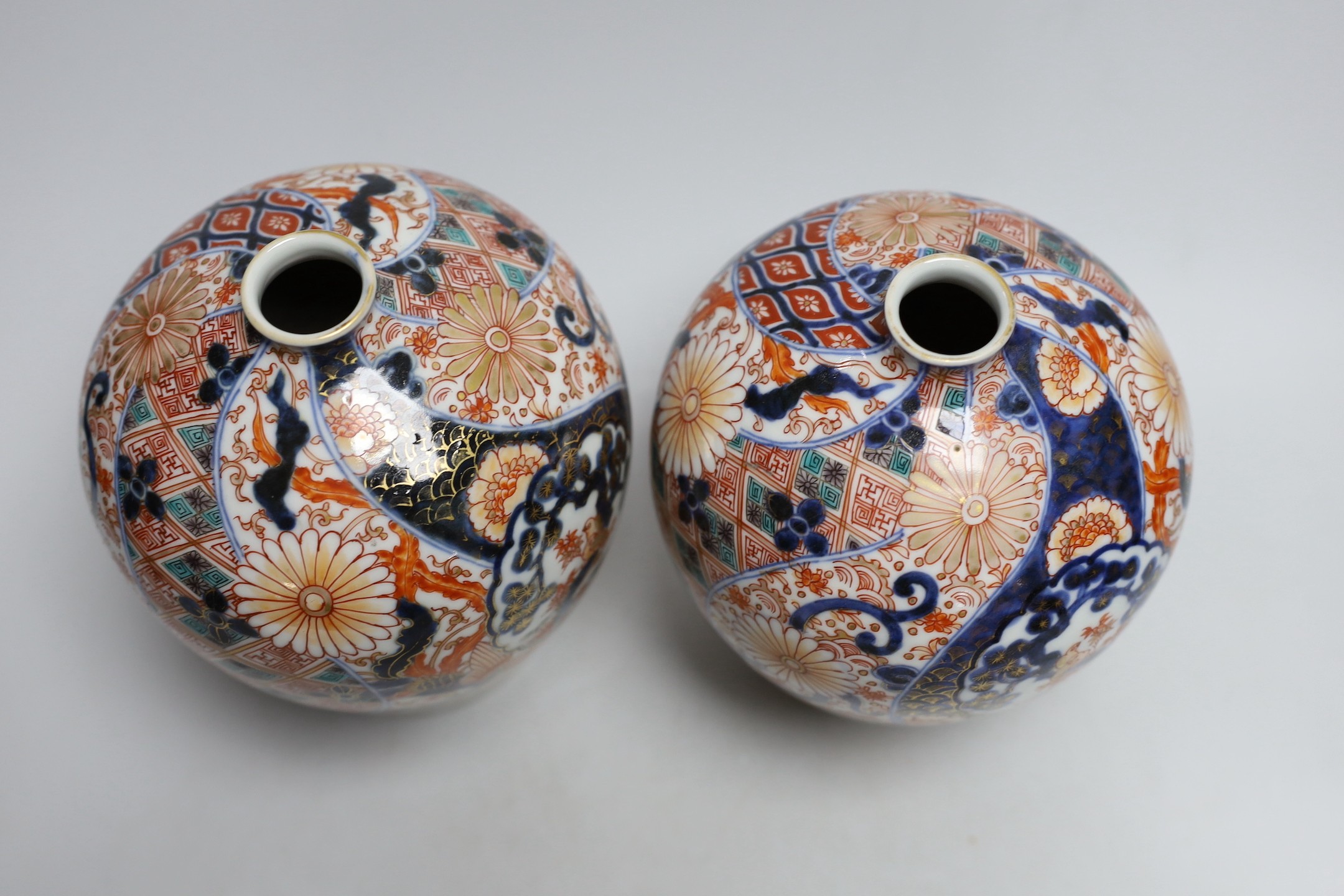A pair of Japanese Fukugawa Imari bottle vases, signed. 19cm tall